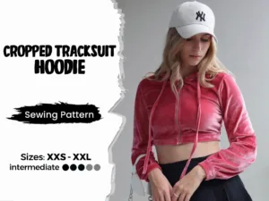 Model wearing a red cropped hoodie made from a sewing pattern and on the left side is a text that says cropped tracksuit hoodie