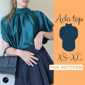 Model wearing a satin blue batwing top made from a sewing pattern and with dolman sleeves
