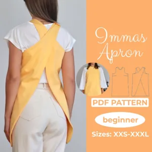 Model wearing a yellow crossback apron made from a sewing pattern