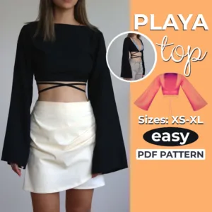 Model wearing a bell sleeve crop top made from a sewing pattern